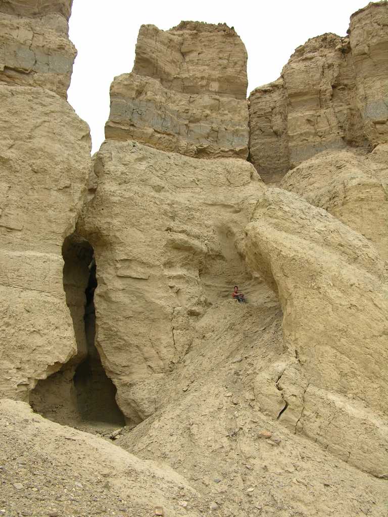 Tibet Guge 01 To 18 Sutlej Canyon Tower With Peter The sandstone cliffs of the Sutlej canyon have eroded into some fantastic shapes. Peter climbed into the cave and then up the side, with the sandstone breaking off in his hands.